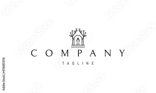 Vector logo on which an abstract image of a gate with a candle flame inside on a background of trees.