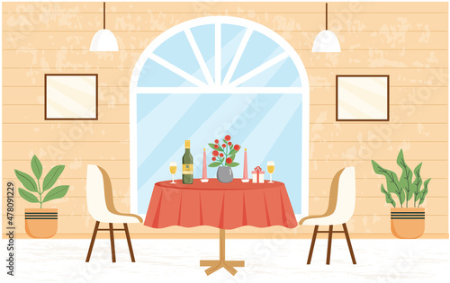 Romantic dinner table. Reserved table at restaurant for two people. Valentine day. Table with bottle of wine, two wine glases, flowers, candels, gift. Modern restaurant, cafe interior.