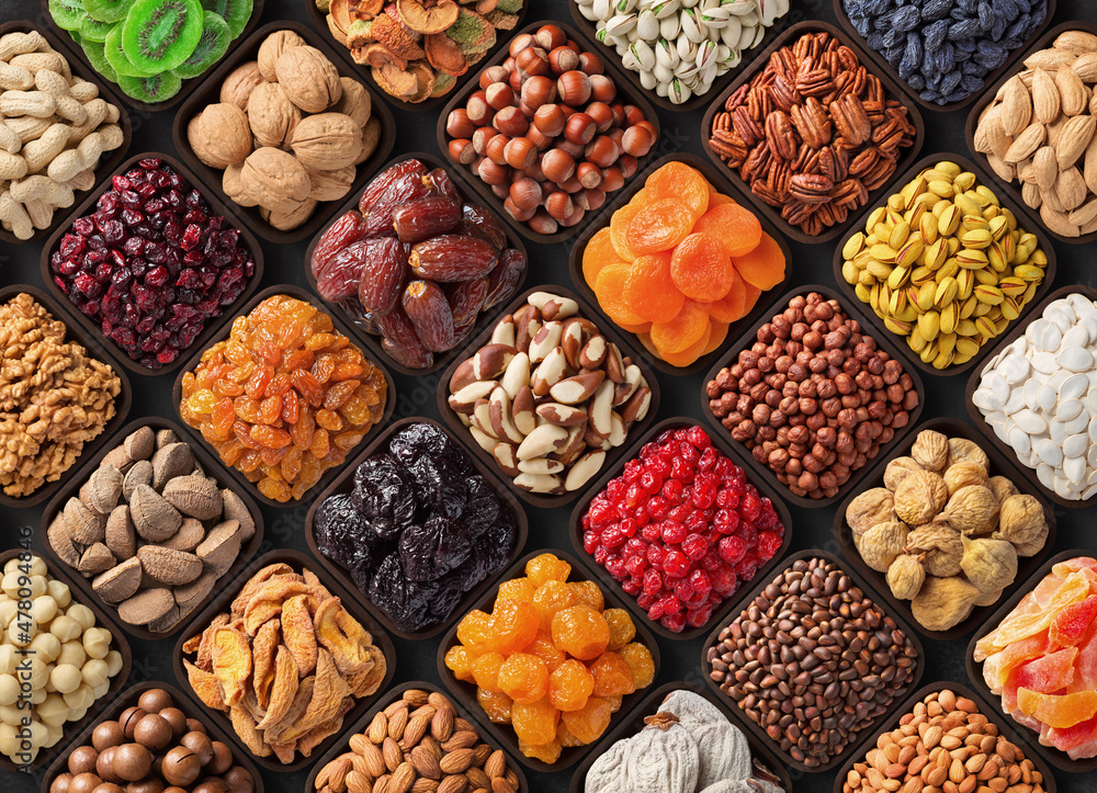 assorted candied berries, dried fruits, nuts and seeds, top view. healthy food background assorted candied berries, dried fruits, nuts and seeds, top view. healthy food background