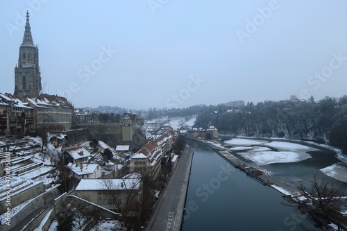 The Spire Bernese Cathedral (Berner Münster) and the old town of Bern, Switzerland. The view from the  Kirchenfeldbrücke bridge over the Aare river.  photo