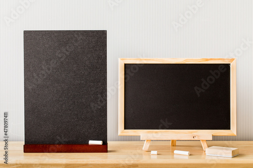 Wooden plank table for graphic stand product, interior design or montage display your product with blank texture blackboard with chalk for background. education concept.