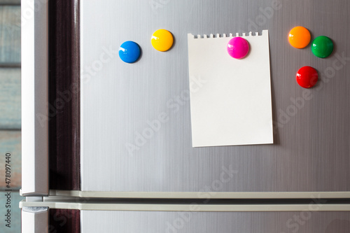 Empty paper sheet on refrigerator door. Note paper with color magnetic. Valentine send text love message.
