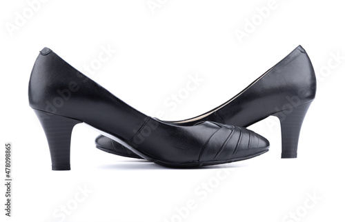 Two women's black shoes on a white background.