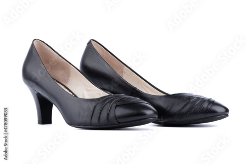 Women's black shoes are located side by side on a white background.