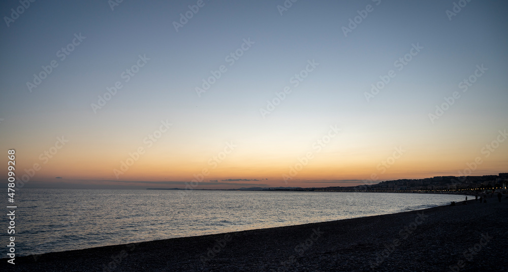 Sunset over Nice beach in winter on the French Riviera