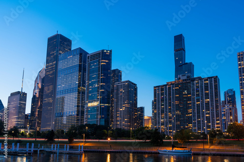 Fototapeta Naklejka Na Ścianę i Meble -  A picturesque view of Downtown skyscrapers of Chicago skyline panorama over Lake Michigan at night time, Chicago, Illinois, USA