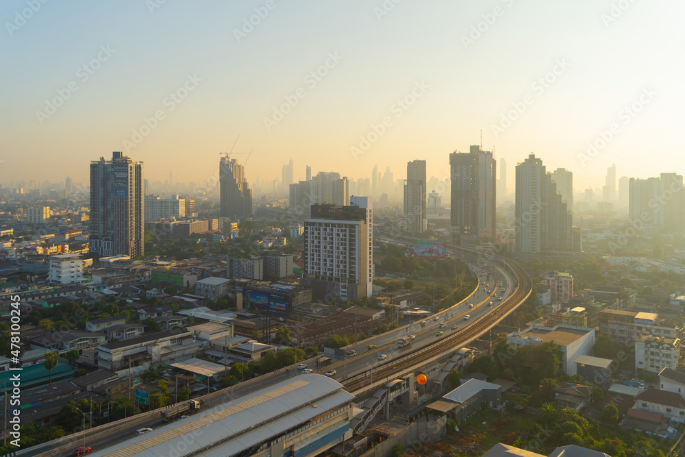 Aerial view of highway street road at Bangkok Downtown Skyline, Thailand. Financial district and business centers in smart urban city in Asia.Skyscraper and high-rise buildings at sunset