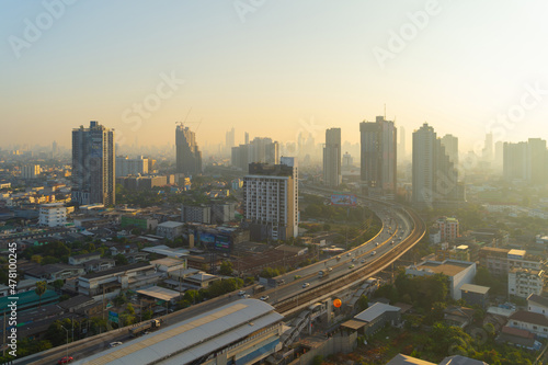 Aerial view of highway street road at Bangkok Downtown Skyline  Thailand. Financial district and business centers in smart urban city in Asia.Skyscraper and high-rise buildings at sunset