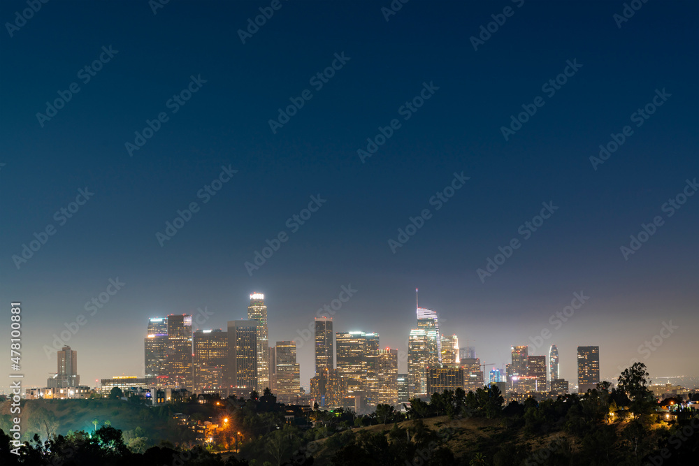 Illuminated Skyline of Los Angeles downtown at summer night time, California, USA. Skyscrapers of panoramic city center of LA.