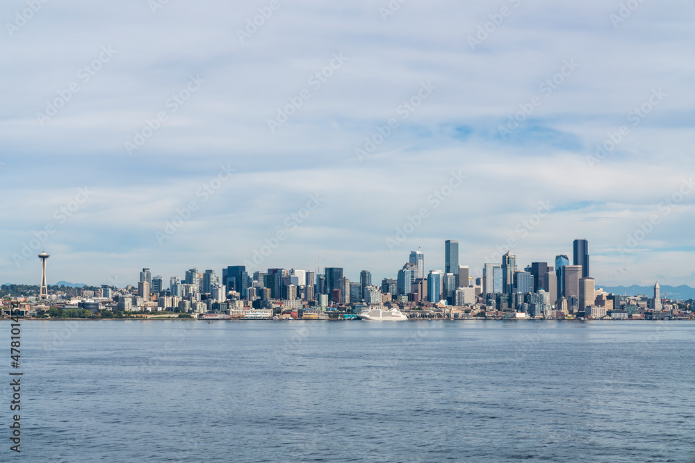 Waterfront Seattle skyline with Great wheel view and iconic observation tower called Space Needle. Skyscrapers of financial downtown at day time, Washington, USA. A vibrant business neighborhood Waterfront Seattle skyline with Great wheel view and iconic observation tower called Space Needle. Skyscrapers of financial downtown at day time, Washington, USA. A vibrant business neighborhood