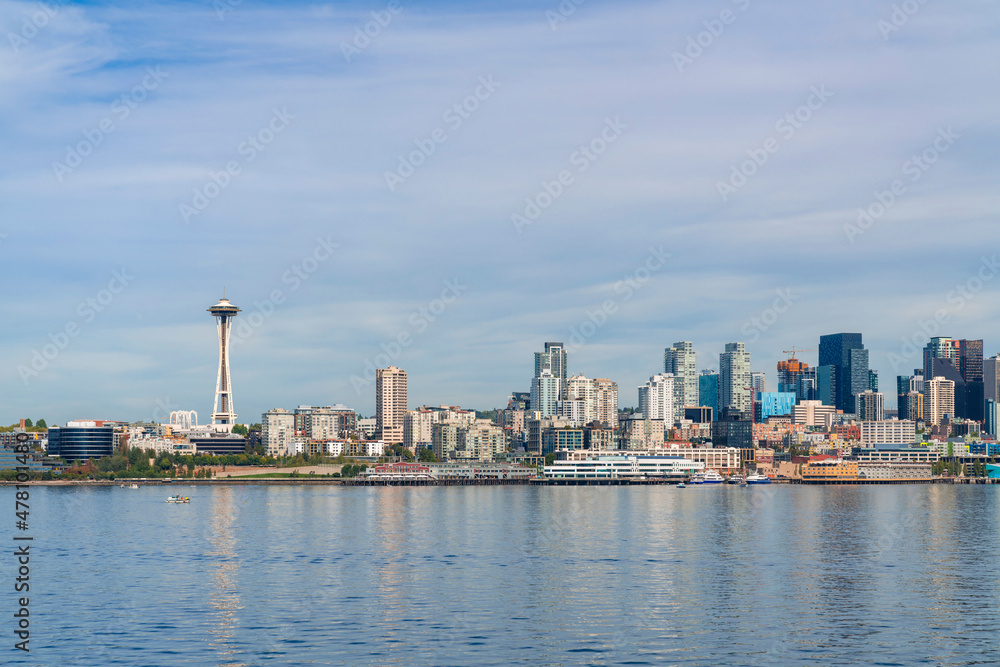 Waterfront Seattle skyline with iconic view observation tower called Space Needle. Skyscrapers of financial downtown at day time, Washington, USA. A vibrant business neighborhood