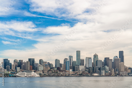 Seattle skyline with waterfront and Great wheel view. Skyscrapers of financial downtown at day time, Washington, USA. A vibrant business neighborhood © VideoFlow