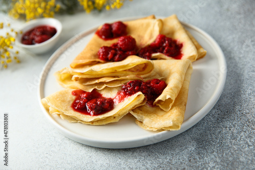 Homemade crepes with raspberry sauce