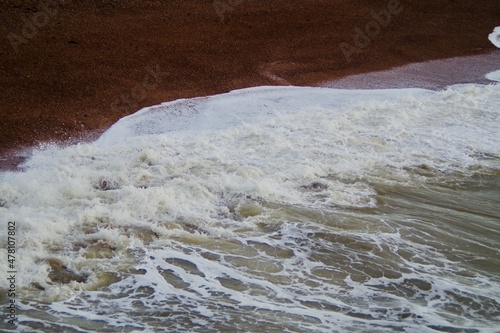 Waves hit the beach © T