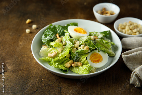 Healthy green salad with cashew and hard boiled eggs