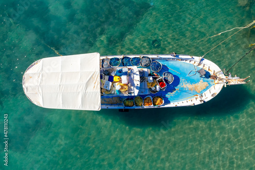Top down view of a fisherman's boat loaded with nets
