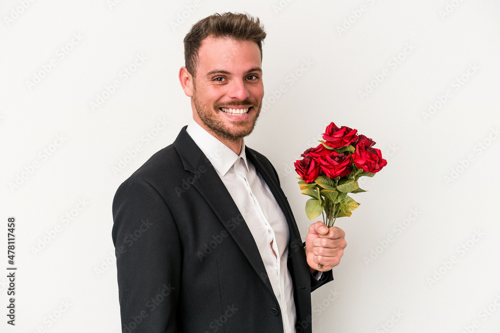 Young caucasian man holding bouquet of flowers isolated on white background Young caucasian man holding bouquet of flowers isolated on white background