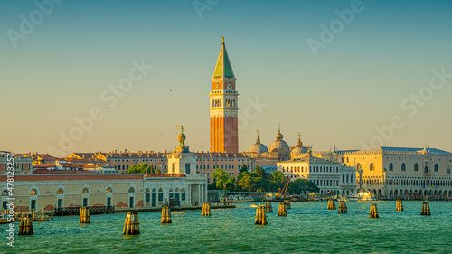 Fotografie, Obraz Panoramic view of Doge Palace, Campanile and San Marco square from Grand Canal main water area during evening warm sunset, Venice, Italy