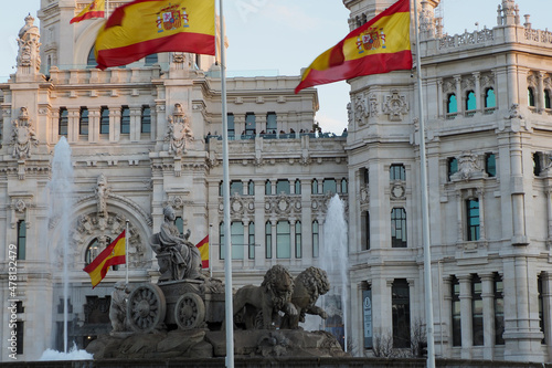 cibeles statue with spanish flags in madrid photo