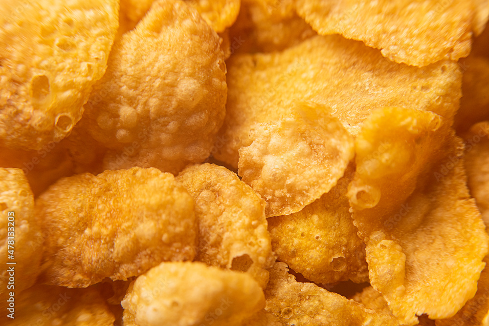 Macro photo of cornflakes, top view of cereals for background and texture Macro photo of cornflakes, top view of cereals for background and texture