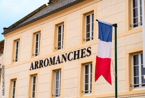 Arromanches, France - August 2, 2021: Arromanches is remembered as a historic place of the Normandy landings - the city hall with the franch flag