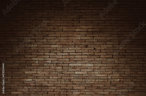 Old brown brick wall with shadow texture can be use as background 