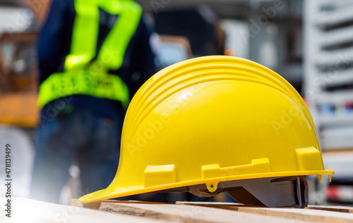 Yellow helmet on site construction background, Safety hardhat , Hard hat engineer