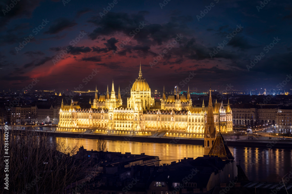 Elevated, panoramic view of the illuminated Hungarian Parliament Building in Budapest during dusk