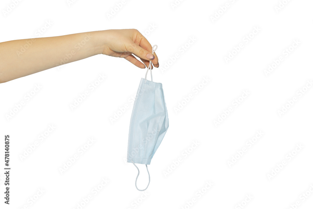 medical mask in hand on white background, concept to pass or throw away mask medical mask in hand on white background, concept to pass or throw away mask