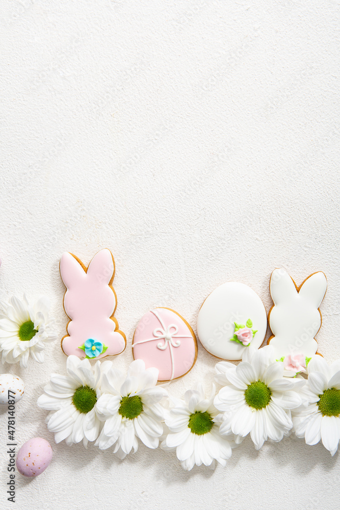 Easter bunny, egg and flowers background top view Easter bunny, egg and flowers background top view