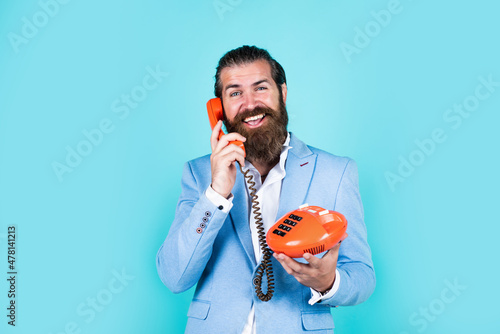 well groomed man in wedding formalwear has beard use retro phone, technology photo