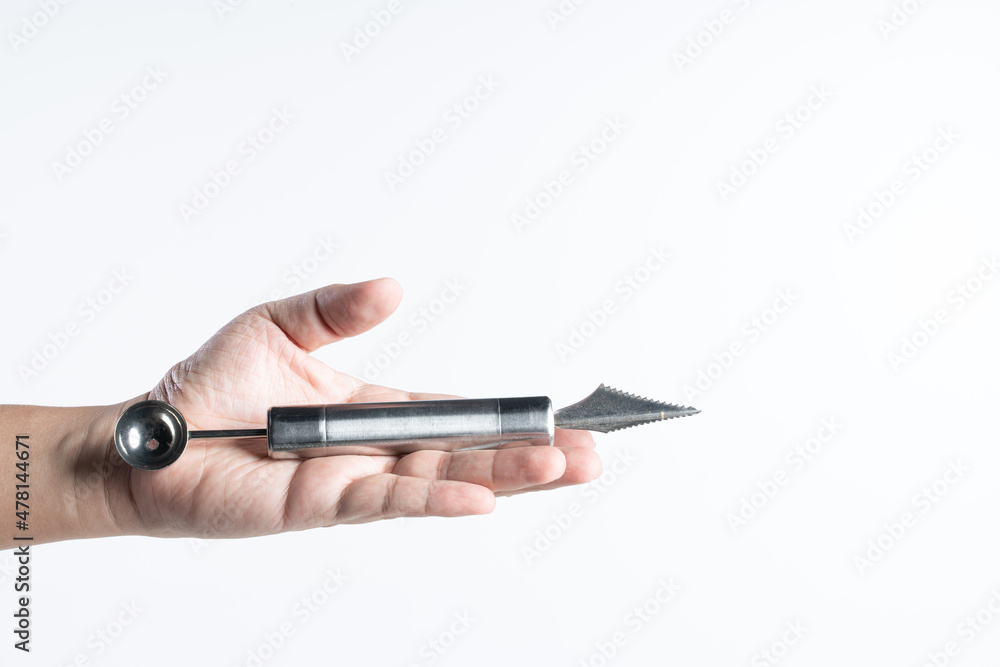 Hand holding Fruit stainless steel vegetable carving knife with scoop end Hand holding Fruit stainless steel vegetable carving knife with scoop end
