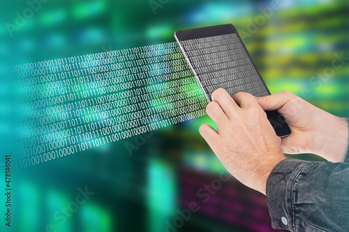 Binary code next to tablet ...