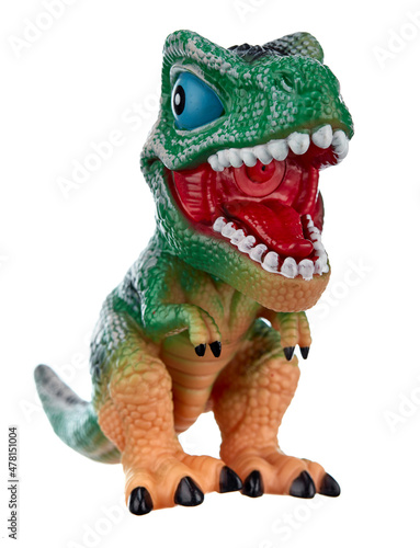 Toy dinosaur with an open mouth full of predatory fangs stands on its hind legs, isolated on a white background. © KPad