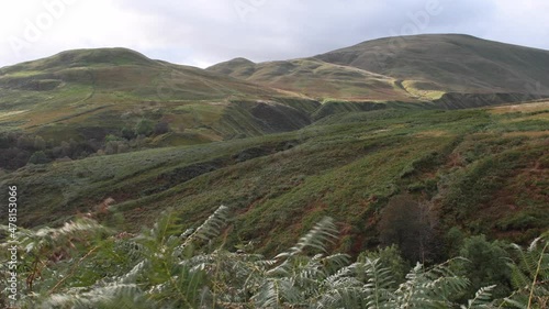 4K video of Ochil Hills that overlook Dollar in Scotland. Nature scene of Scottish Highlands. Windy day. 