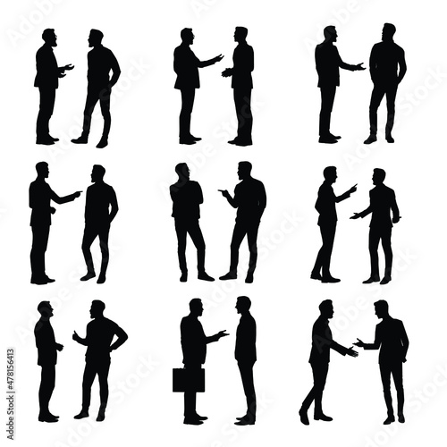 The Silhouette Of Two Men Having A Discussion Set