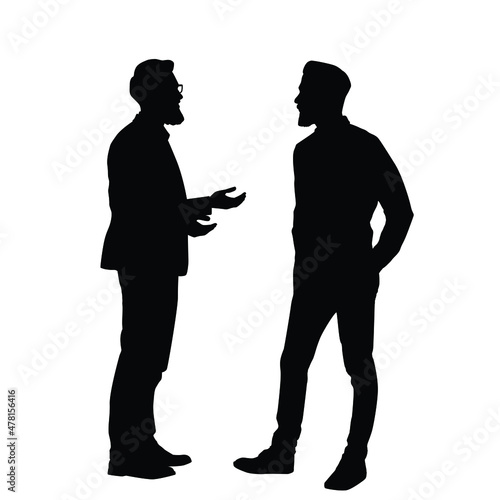 The Silhouette Of Two Men Having A Discussion