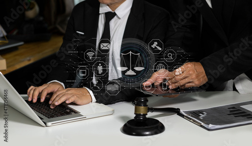 Concepts of Law and Legal services. Lawyer working with law interface icons. Blurred background. 