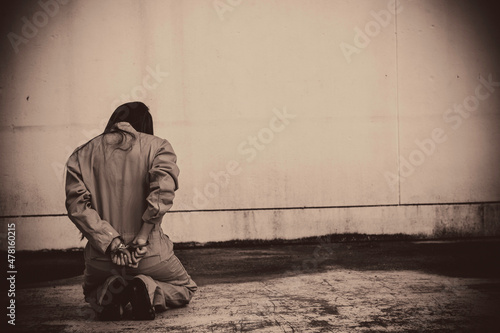 Fotografie Prisoner in orange robe concept,Portrait of asian woman in Prison uniforms on wh
