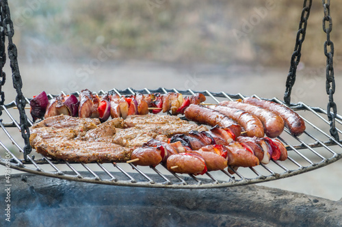 Grilled pork neck, skewers and sausage.