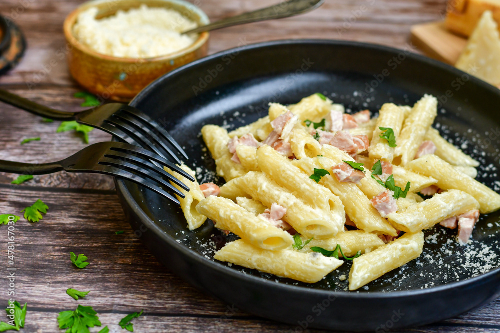 Fresh home made italian penne pasta alla carbonara with cream sauce , bacon,egg, parmesan cheese ,olive oil and black pepper) Fresh home made italian penne pasta alla carbonara with cream sauce , bacon,egg, parmesan cheese ,olive oil and black pepper)