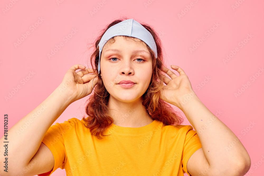 beautiful woman in a yellow t-shirt medical mask protection cropped view unaltered beautiful woman in a yellow t-shirt medical mask protection cropped view unaltered