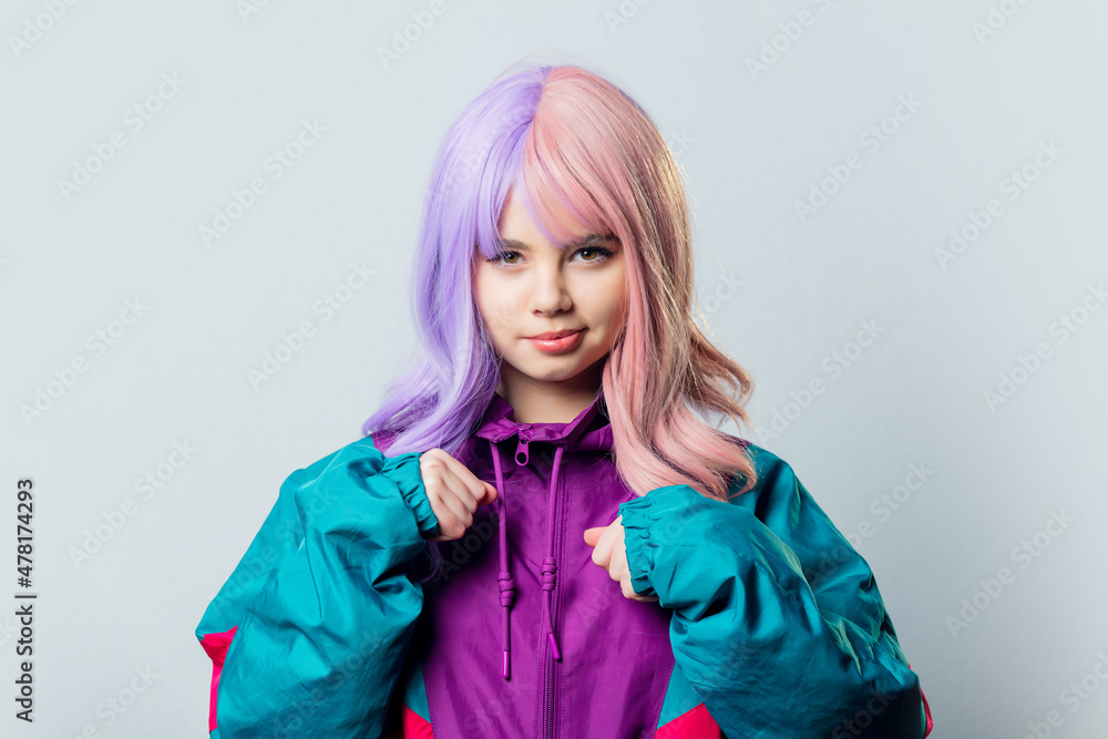 Beautiful yandere girl with purple hair and 80s tracksuit on gray background Beautiful yandere girl with purple hair and 80s tracksuit on gray background