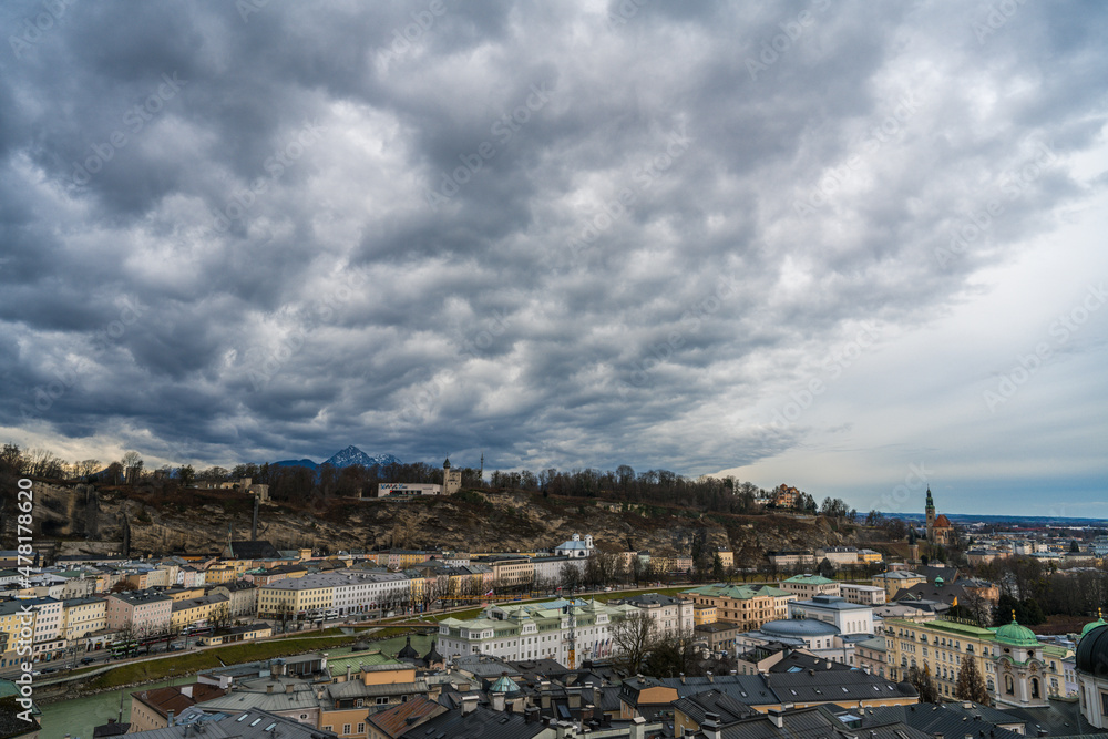 view of the city of salzburg before rainstorm
