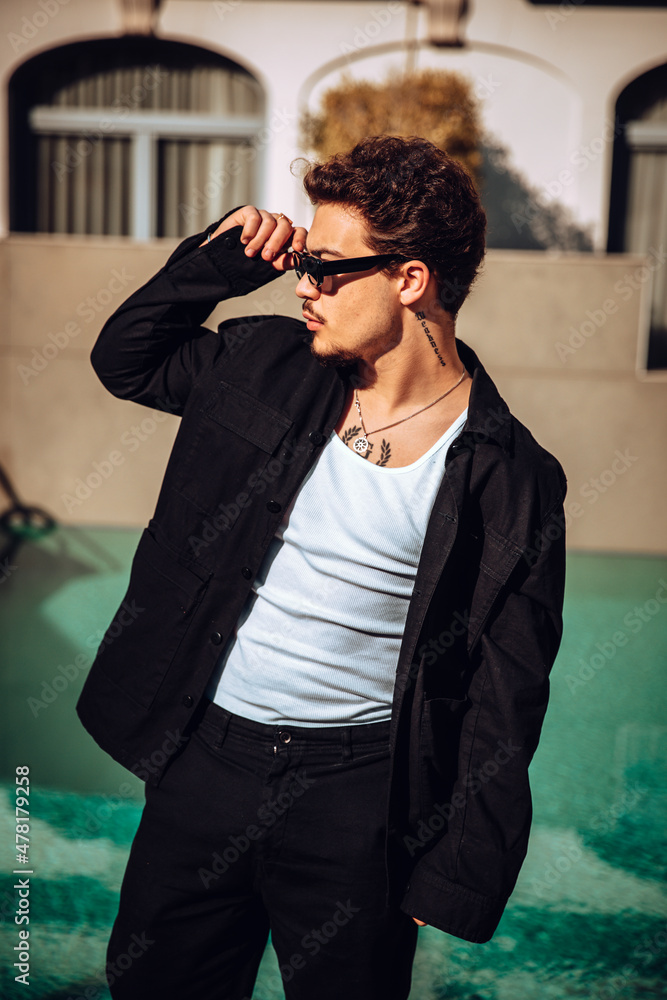 Stylish tattooed man looking to the side