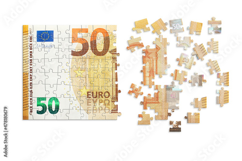 Puzzle made from fifty euro note and isolated on a white background. Inflation and hyper inflation in Europe.