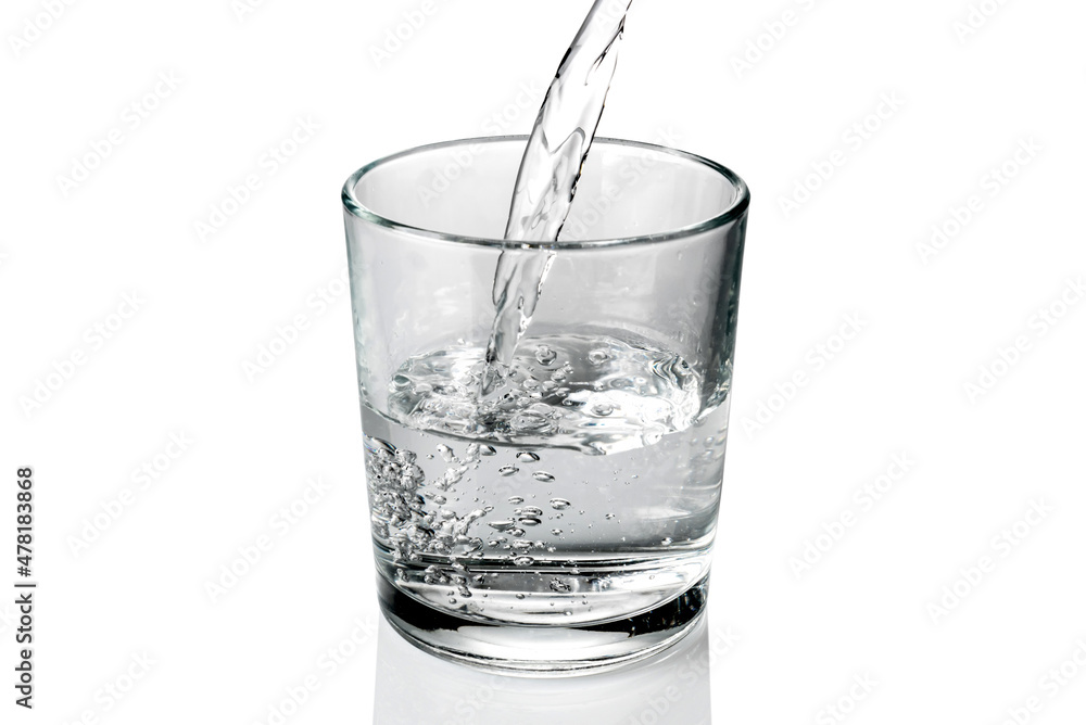 fresh water pouring into the glass isolated on white fresh water pouring into the glass isolated on white