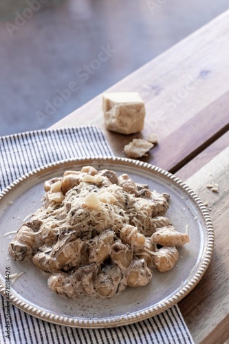 Gnocchi with vegan creamy sauce, porcini mushrooms and vegan cheese