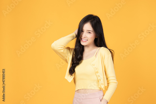 Portrait of beautiful young Asian girl model long hair in casual summer clothes smile, happy and enjoying in studio isolated on white background.