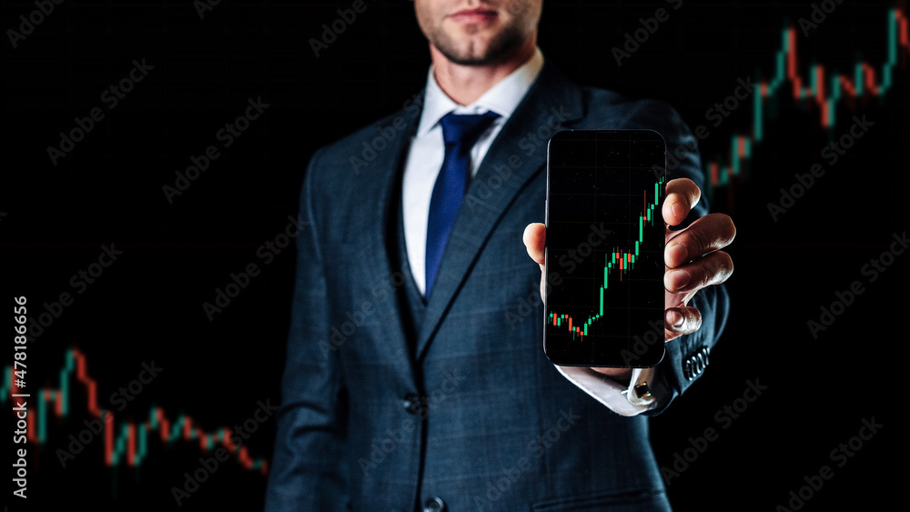 Sell and buy. Investment business technology app on digital screen in businessman hands. Finance application for sell, buy and analysis profit dividend statistics. Candlestick chart banner. Sell and buy. Investment business technology app on digital screen in businessman hands. Finance application for sell, buy and analysis profit dividend statistics. Candlestick chart banner.